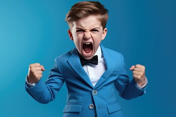Anger Boy In A Blue Suit On Pastel Background . Сoncept Expressing Emotions Through Color, Calmly Responding To Anger, The Power Of Visual Representations, Determining The Effect Of Color On Mood - obrazy, fototapety, plakaty