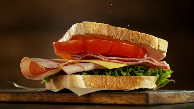 Super slow motion of stacking sandwich pieces. Camera in motion. Filmed on high speed cinema camera, 1000 fps. Placed on high speed cine bot. Speed ramp effect.