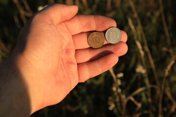 Coins ten pfennig in hand