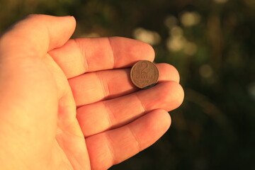 Old small soviet coin in hand