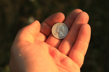 Coin quarter dollar in hand
