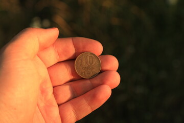 Coin ten forint in hand