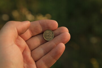 Coin ten senti in hand