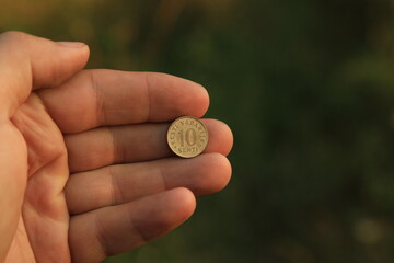 Coin ten senti in hand