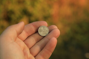 Old Soviet commemorative coin in hand