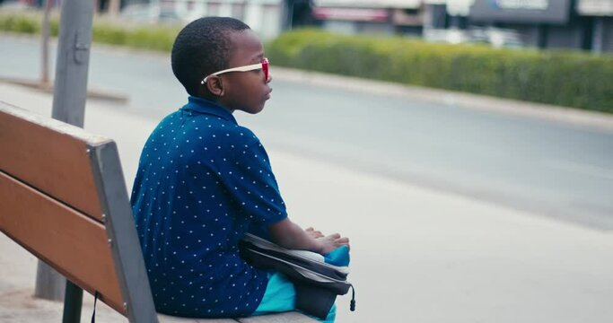 Young boy going at school alone 