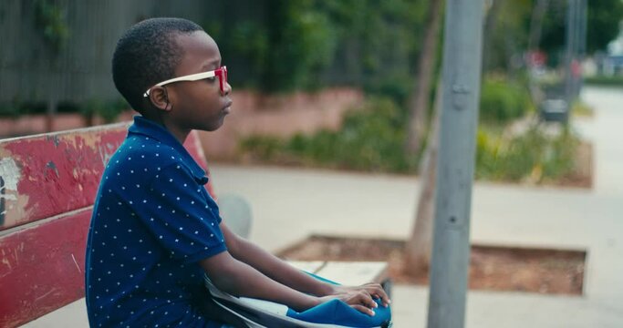 Young boy going at school alone 