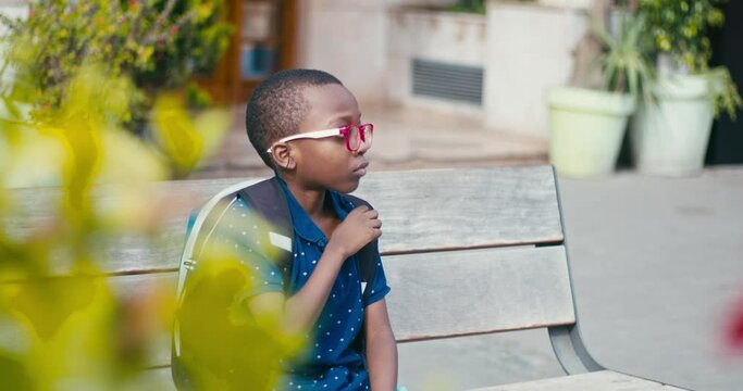 Young boy going at school alone 