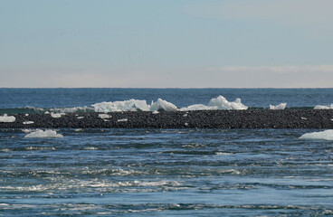 Icebergs on a Black Sand Bar in Iceland