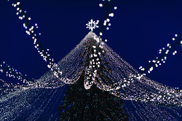 Silver blue magic twinkling bokeh lights of Christmas tree. New Year festive background wallpaper