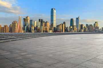 City square and skyline with modern buildings in Chongqing at sunrise, Sichuan Province, China.