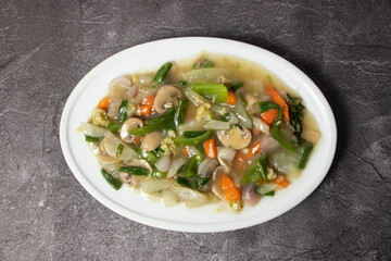 Chines Vegetables with onion, carrot, Capsicum and tomato served in dish isolated on background top view of bangladesh food