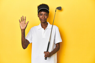 African golfer woman with her golf club, sports concept, smiling cheerful showing number five with...