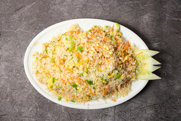 Egg Fried Rice with capsicum and cucumber served in dish isolated on background top view of bangladesh food