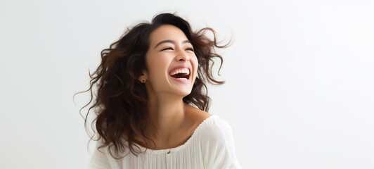A woman in a white shirt is laughing, smiling and cheerful. on a white background.