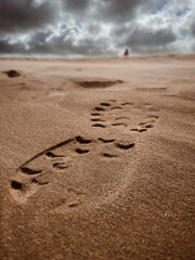 wind on a footprint on the sand