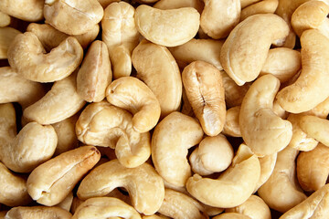 Cashew nut heap food texture background. Cashew goodness in a heap, top view