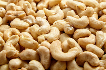 Cashew nut heap food texture background. cashews, ready to munch