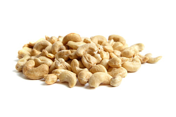 Cashew nut heap isolated on white background. Closeup of delicious cashews