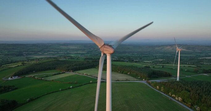 Beautiful windmills against a backdrop of verdant meadows 4k