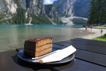 Cake near Lake Braies (or Lago di Braies) famous lake in Dolomites Alps Italy Europe extra wide panorama