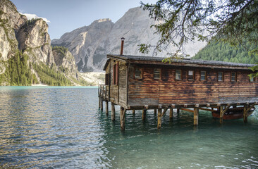 Lake Braies (or Lago di Braies) hut on the lake famous lake in Dolomites Alps Italy Europe extra wide panorama