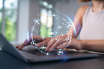 Woman typing on laptop at office workplace in background. Concept of working process, internet surfing, online business education. Student send e-mail. Close up view. Social network icons