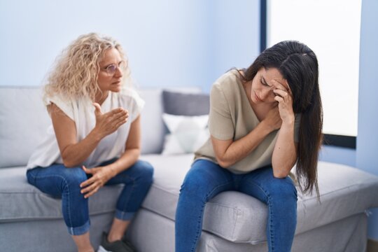 Two women mother and daughter arguing at home - Powered by Adobe