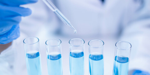 Blue glass test tube glassware liquid sample pipette equipment in chemical chemistry biotechnology laboratory science research analysis experiment test industry, scientific pharmaceutical medical