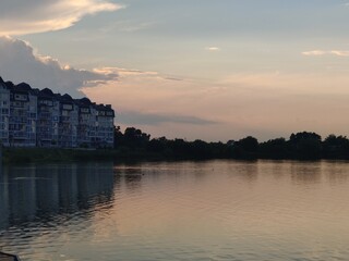 Naklejka premium sunset over the river
