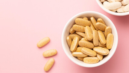 long wide banner, medicines on a light pink background in a white container