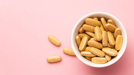 long wide banner, medicines on a light pink background in a white container