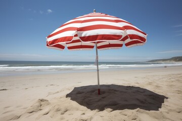 A colorful umbrella on a sandy beach