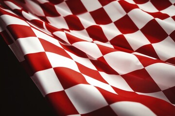 A red and white checkered fabric on a black background