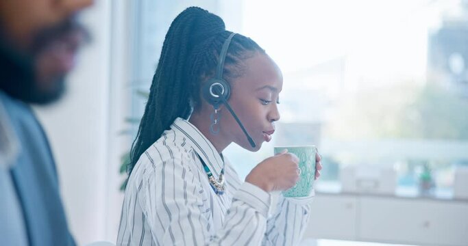 Black woman, call center and drinking coffee in customer service, support or telemarketing at the office. African female person, consultant or agent enjoying hot beverage in contact us at workplace