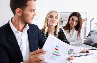 Group of people hold silver pen ready to make note in clipboard pad sheet closeup. Training course...