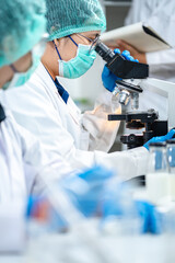 professional chemist woman laboratory using scientific microscope for science research, chemistry...
