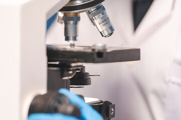 Closeup of Scientific microscope data analysis in the laboratory, medicine equipment setting in lab for chemistry or science research technology discovery, biotechnology or biology tool for study