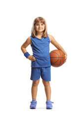 Little girl in a blue jersey kit holding a basketball and smiling