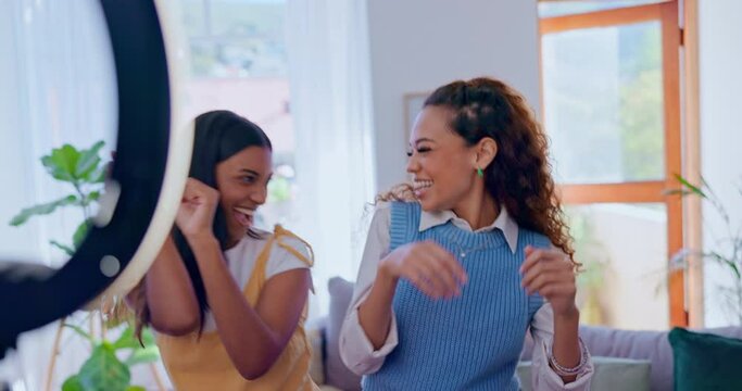 Women, social media dance challenge and live stream in living room with high five and fun laugh together. Content creator, influencer and happy girl friends in lounge recording viral video broadcast.