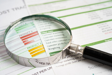 Magnifying glass on graph paper. Financial development, Banking Account, Statistics, Investment...