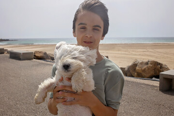 Family with children, visiting the most south point of Europe, Tarifa in Spain © Tomsickova