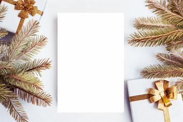 Christmas vertical poster mockup with gold toys and spruce branch