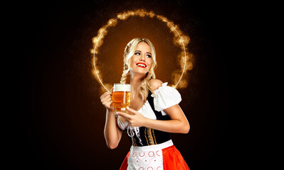 Smiling young sexy oktoberfest girl waitress, wearing a traditional Bavarian or german dirndl,...