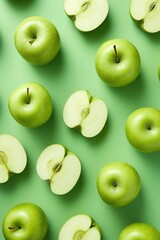 Green apples on green background. Overhead view.