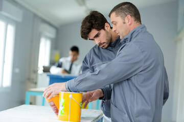 a man showing paint samples