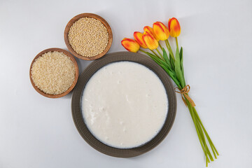 Selective focused image of fermented batter for idli and dosa in an isolated background. Idly and dosa batter in a bowl for fermentation, used to prepare the dosa and idli..