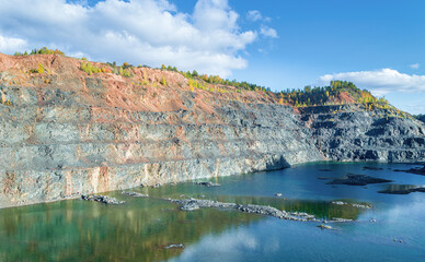 Abandoned Open Pit Mineral Mine with a Lake at the Bottom