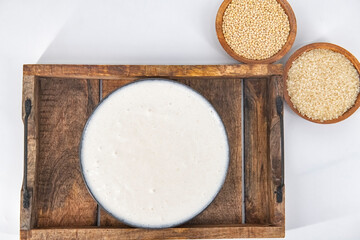 Selective focused image of fermented batter for idli and dosa in an isolated background. Idly and dosa batter in a bowl for fermentation, used to prepare the dosa and idli..