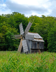 Fototapeta na wymiar old wooden windmill in the countryside